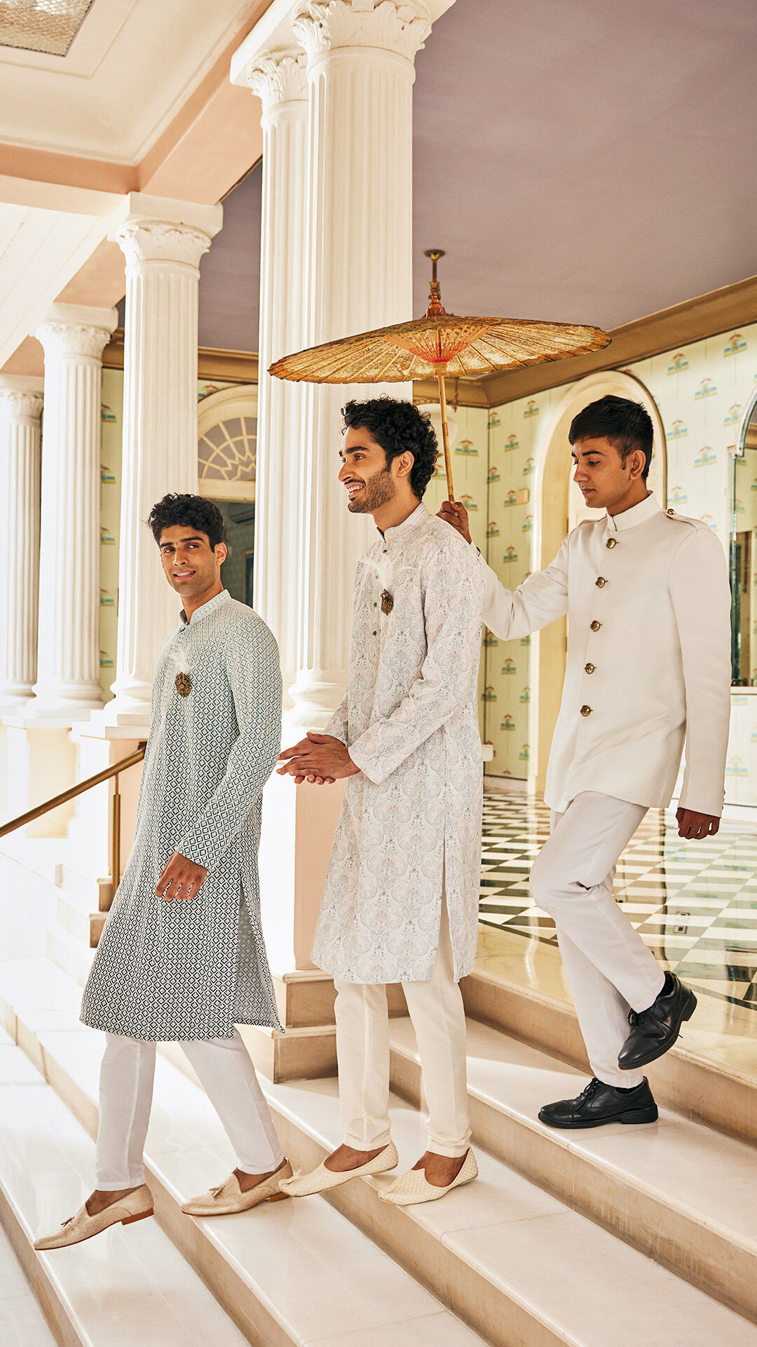 Men walking on stairs wearing stylish designed juttis with elegant kurta pajama